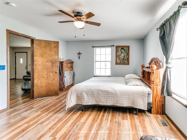 bedroom with ceiling fan and wood-type flooring