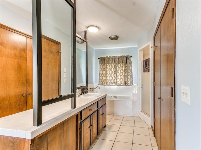 bathroom featuring tile patterned flooring, vanity, and independent shower and bath