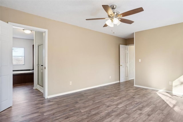 spare room with ceiling fan and hardwood / wood-style floors