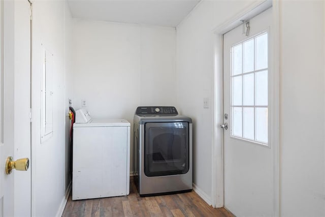 washroom with dark hardwood / wood-style flooring and independent washer and dryer