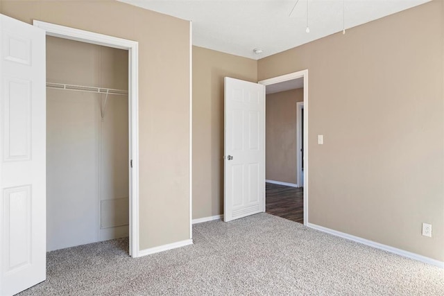 unfurnished bedroom with carpet and a closet