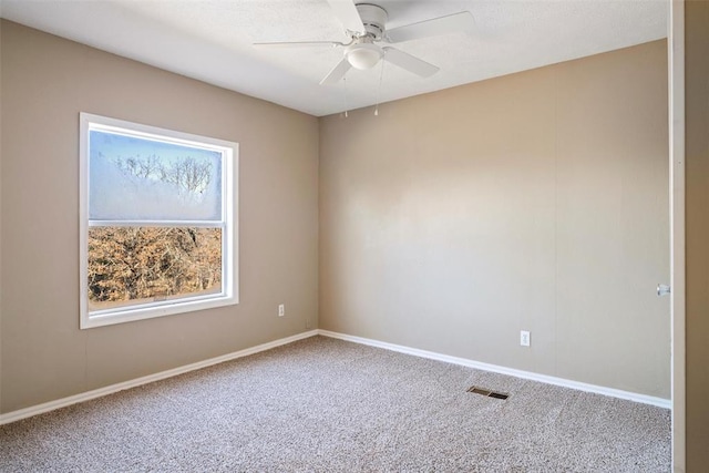 unfurnished room featuring carpet and ceiling fan