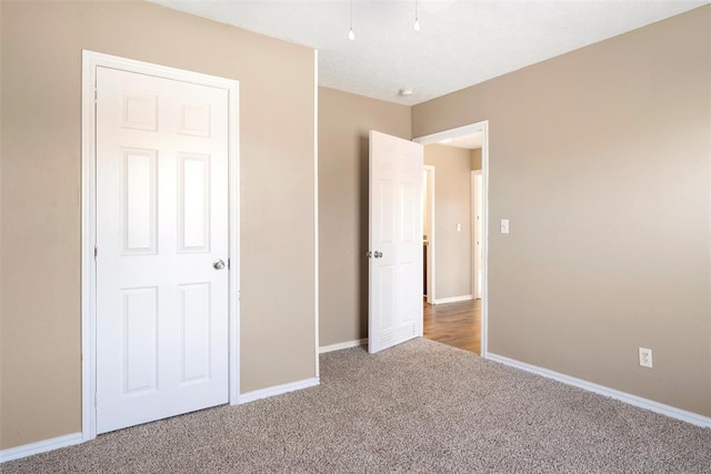 unfurnished bedroom with carpet floors