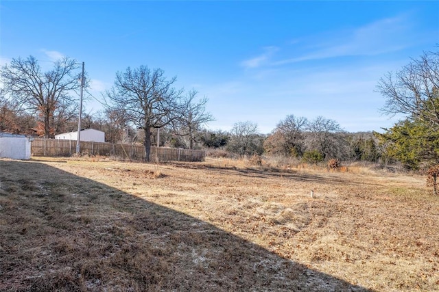 view of yard with a rural view