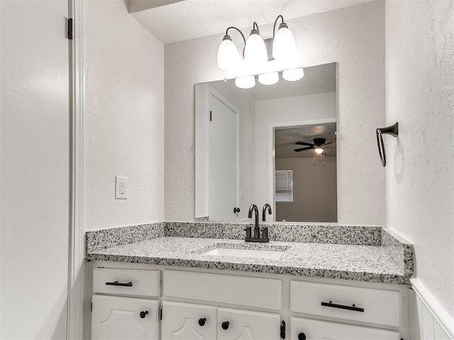 bathroom featuring vanity and ceiling fan