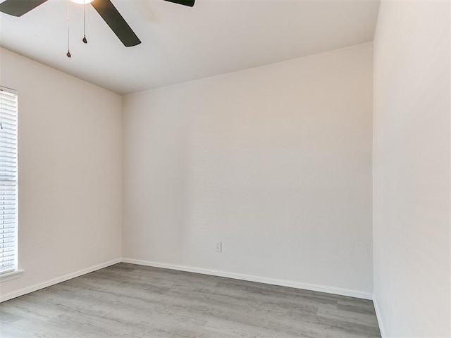 spare room featuring light hardwood / wood-style flooring and ceiling fan