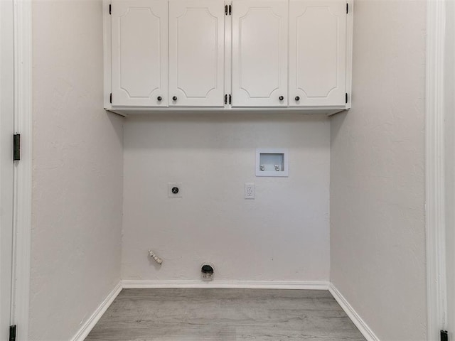 laundry area with cabinets, washer hookup, electric dryer hookup, gas dryer hookup, and light wood-type flooring