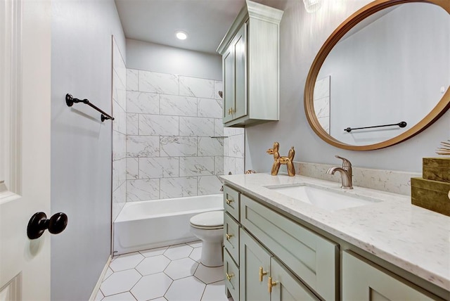 full bathroom with vanity, tile patterned floors, toilet, and tiled shower / bath