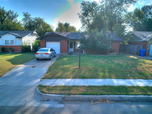 ranch-style home with a front yard and a garage