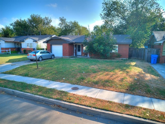 ranch-style house with a garage and a front lawn