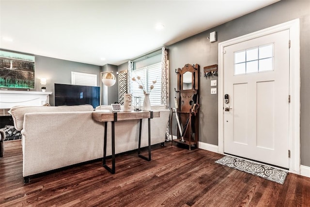 living room featuring dark hardwood / wood-style floors and plenty of natural light