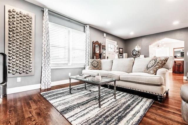 living room with dark hardwood / wood-style floors