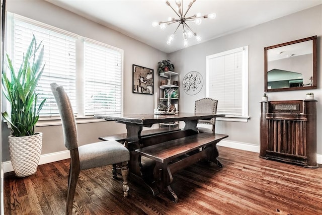 dining space with an inviting chandelier and hardwood / wood-style floors