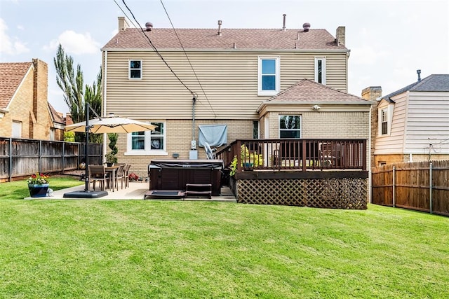 back of house featuring a patio area, a yard, a hot tub, cooling unit, and a deck