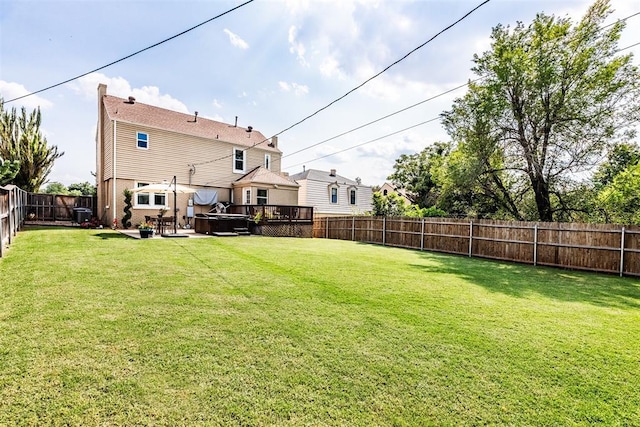 view of yard with a patio area and a wooden deck