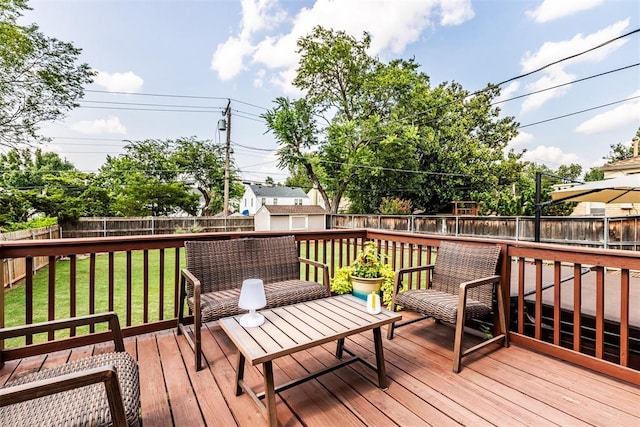 wooden deck with a lawn