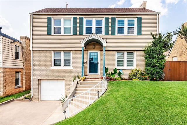 view of front of house featuring a front yard and a garage