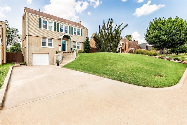 view of front of home featuring a front lawn and a garage