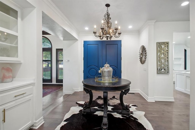 foyer entrance with recessed lighting, crown molding, dark wood-type flooring, and baseboards