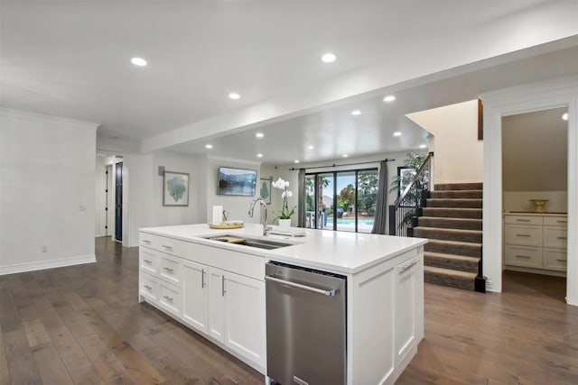 kitchen featuring sink, dishwasher, dark hardwood / wood-style floors, white cabinetry, and an island with sink