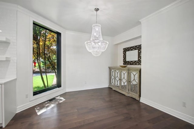 unfurnished dining area featuring crown molding, a notable chandelier, wood finished floors, and baseboards