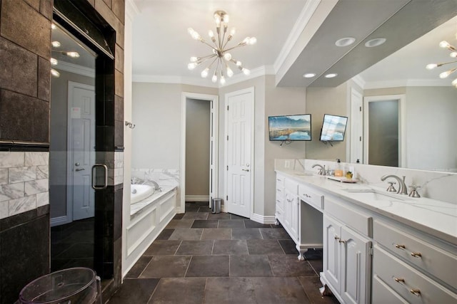 bathroom with double vanity, a sink, ornamental molding, a garden tub, and a notable chandelier