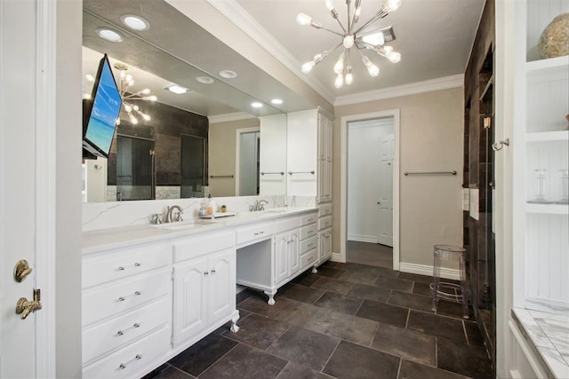 bathroom with double vanity, a stall shower, a sink, ornamental molding, and a chandelier