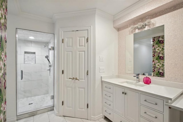 bathroom with a stall shower, vanity, wallpapered walls, and ornamental molding