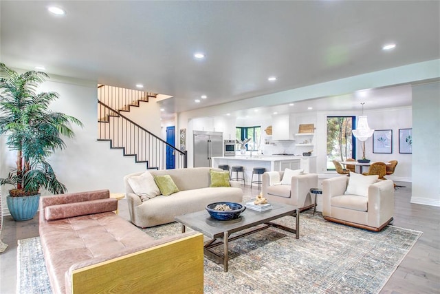5801 Oak Tree Rd, Edmond, OK 73025 - living area with recessed lighting, stairs, and wood finished floors