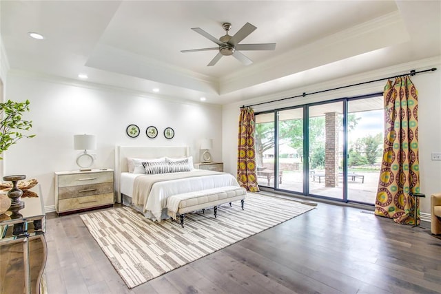 5801 Oak Tree Rd, Edmond, OK 73025 - bedroom with a tray ceiling, ornamental molding, access to exterior, wood-type flooring, and recessed lighting