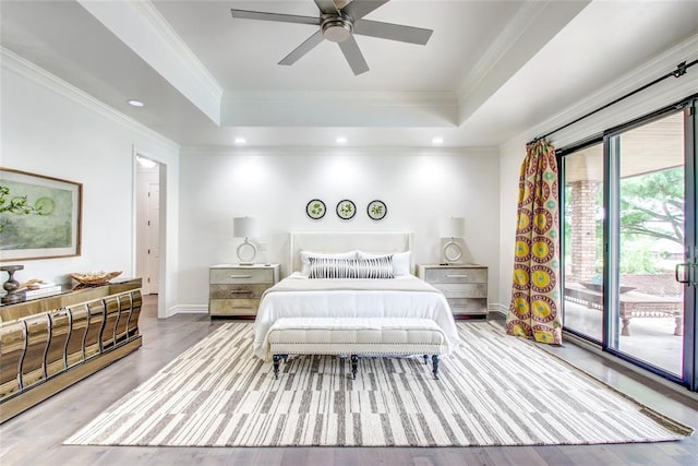 5801 Oak Tree Rd, Edmond, OK 73025 - bedroom featuring a raised ceiling, ornamental molding, wood finished floors, access to outside, and a ceiling fan