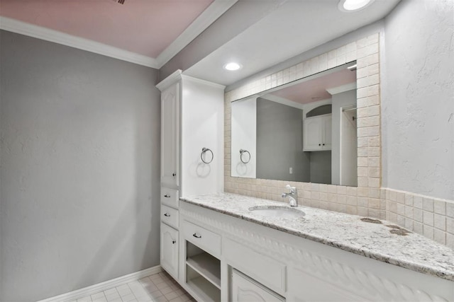 5801 Oak Tree Rd, Edmond, OK 73025 - bathroom with vanity, tasteful backsplash, tile patterned floors, crown molding, and recessed lighting