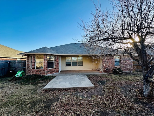 rear view of house featuring a patio