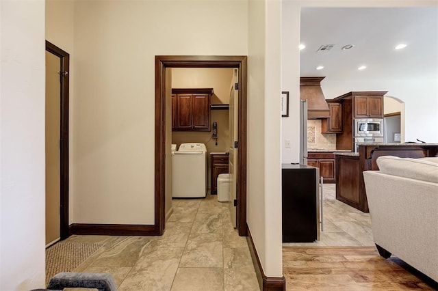 kitchen with decorative backsplash, a breakfast bar, and stainless steel appliances