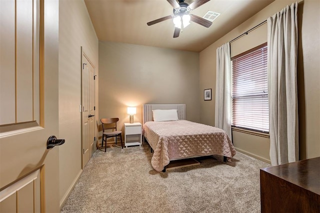 bedroom featuring ceiling fan and light colored carpet