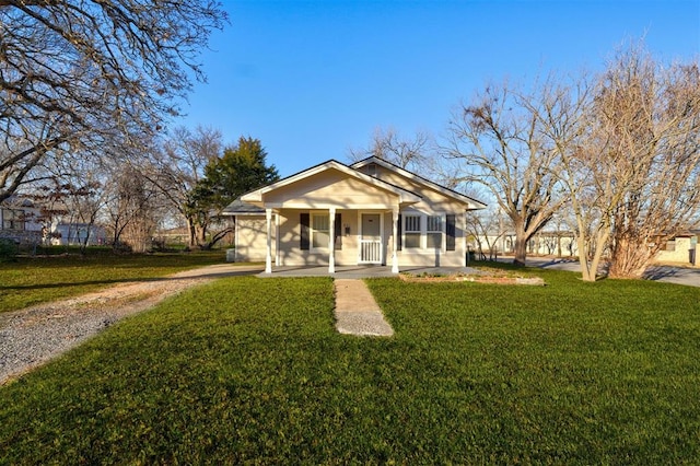 view of front of property with a porch and a front yard