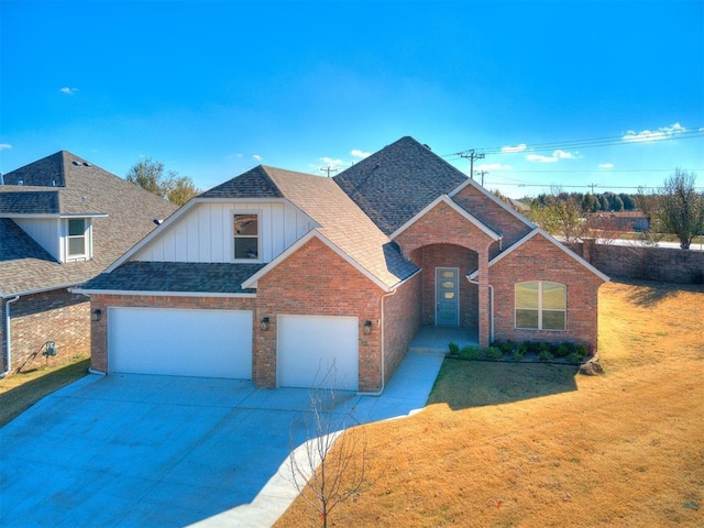 front facade with a garage and a front lawn