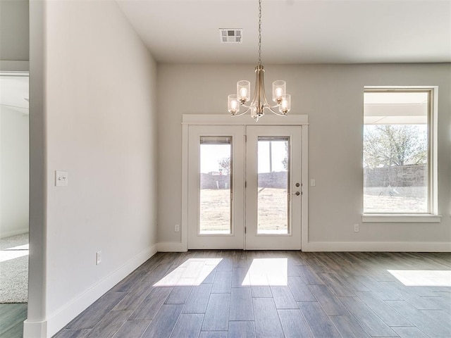 entryway with an inviting chandelier