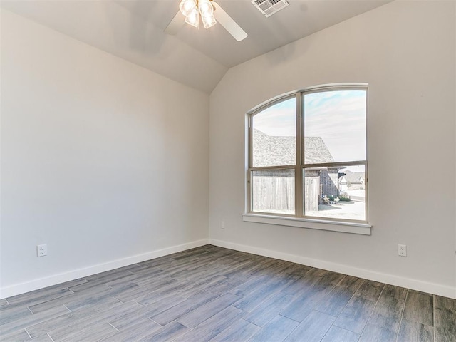 spare room featuring ceiling fan and vaulted ceiling