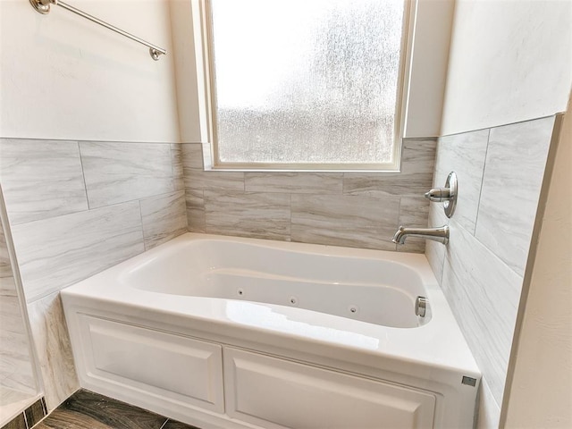 bathroom with a tub to relax in