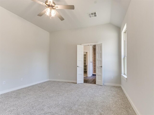 11400 NW 109th St, Yukon, OK 73099 - unfurnished bedroom featuring carpet flooring, vaulted ceiling, and ceiling fan