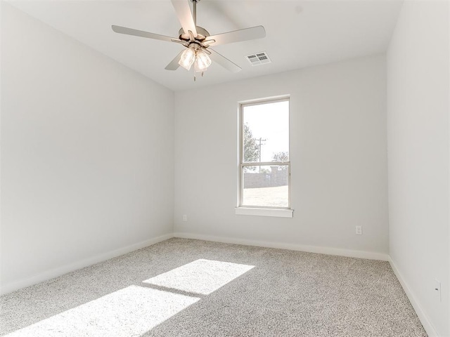 unfurnished room featuring carpet and ceiling fan