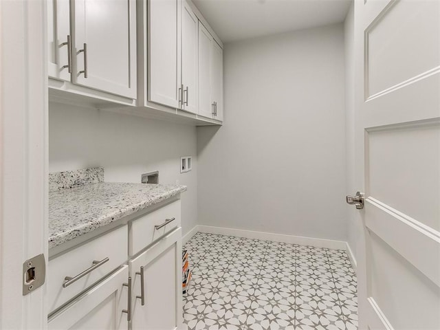 laundry area featuring cabinets and washer hookup