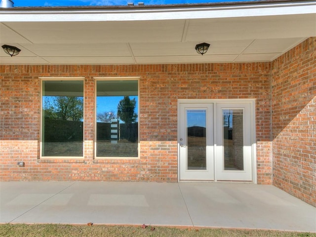 entrance to property with a patio area and french doors