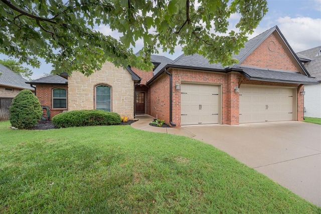 view of front of house with a garage and a front yard