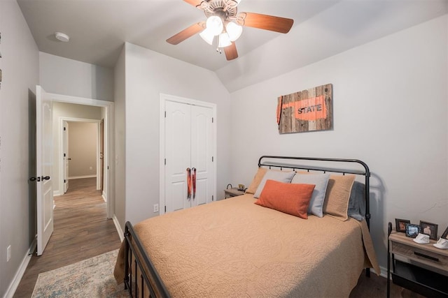 bedroom featuring a closet, ceiling fan, and dark hardwood / wood-style flooring