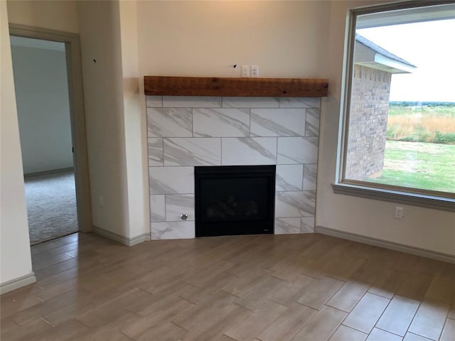 interior details with a tile fireplace