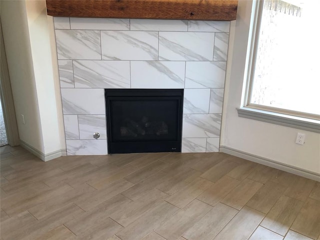 interior details with a tiled fireplace