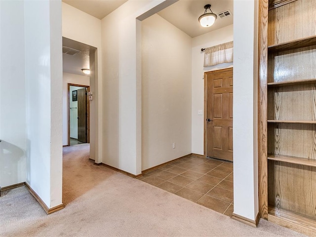 view of carpeted foyer