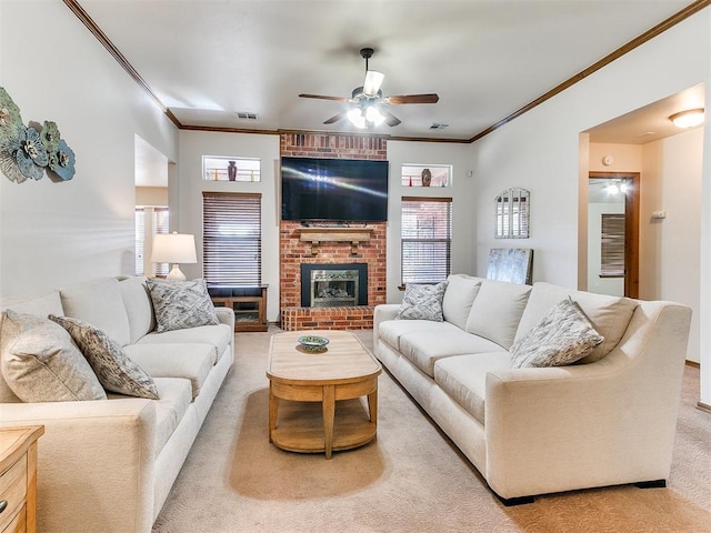 carpeted living room with ceiling fan, ornamental molding, and a brick fireplace